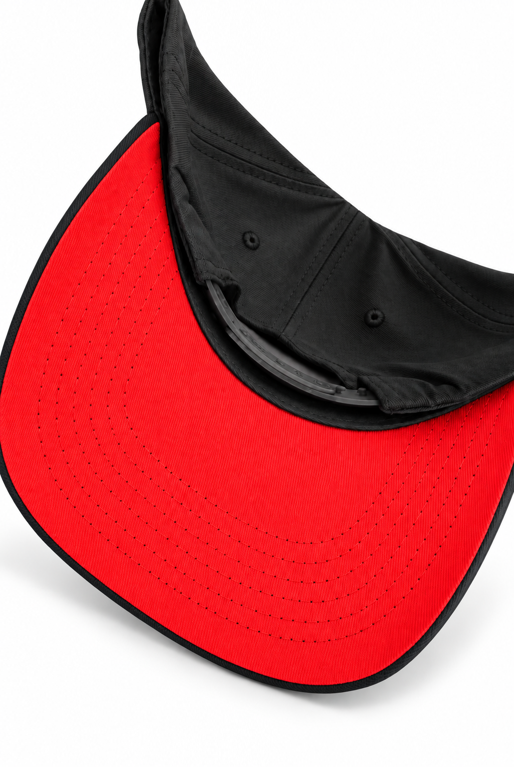 Close-up of a visor-style cap showing a bright red perforated brim and black interior lining on a white background.