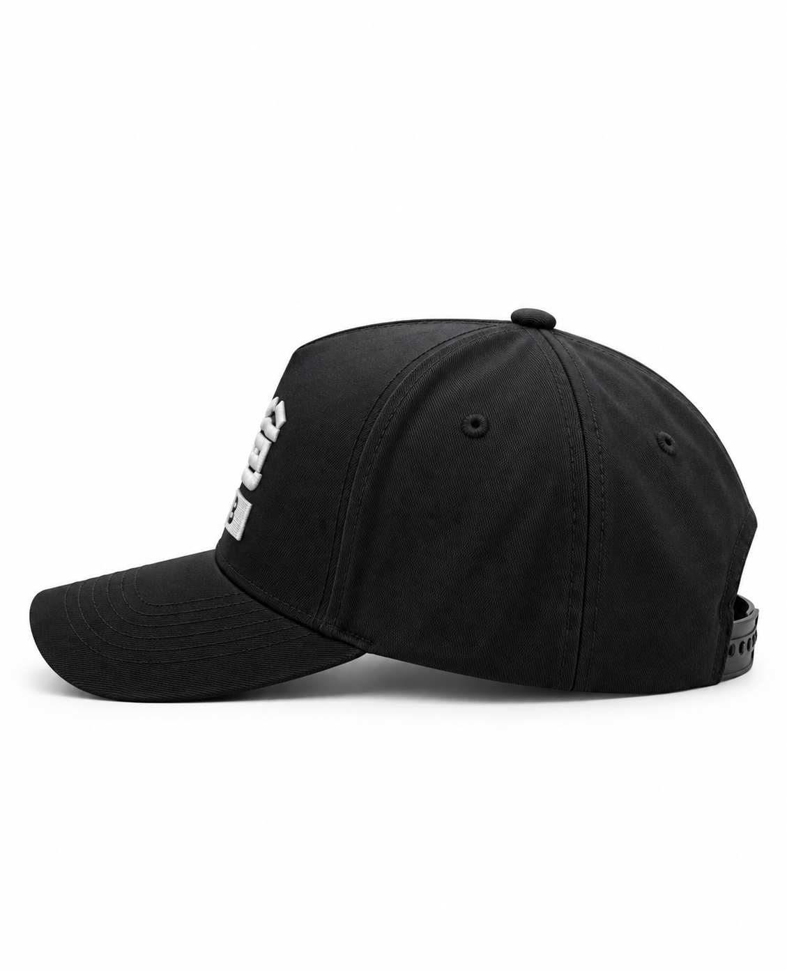 A black baseball cap with a white embroidered star logo on the side, photographed from a side profile against a light beige textured background.