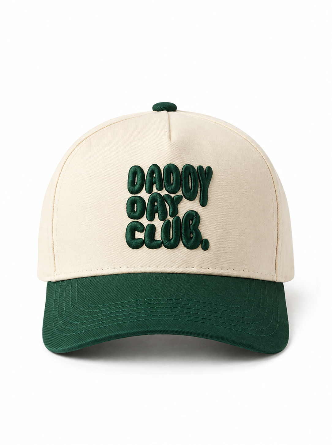 Front view of a cream and forest green Daddy Day Club baseball cap featuring bold, raised dark green "DADDY DAY CLUB." embroidery on the front. The hat has a cream crown, curved forest green brim, and matching green top button, displayed against a clean white studio background.